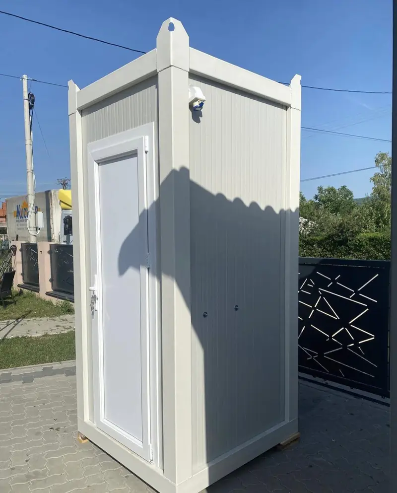 White cabin-style deluxe flushing restroom